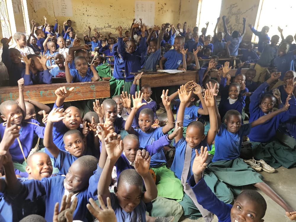 Volunteers supporting a local children's programme in Mwanza